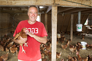 Flamig Farm Farm Nevin holding a chicken